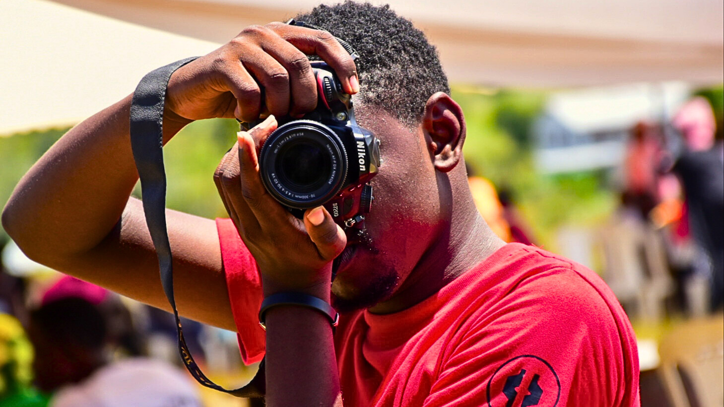 A KNOB digital photographer on duty at a shoot in Kwale County, Kenya